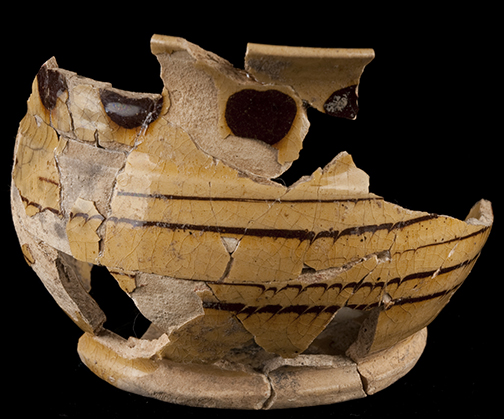 North Midlands slip decorated handled drinking pot/cup decorated with dotted, trailed and combed decoration. Rim diameter: 4.75&rdquo;; Vessel Height: 3.40&rdquo;; Object  ID:  2999. Learn more about this object at:http://mountvernonmidden.org/default.html